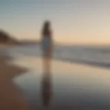 A woman standing alone on a beach, gazing at the horizon with a sense of longing and contemplation