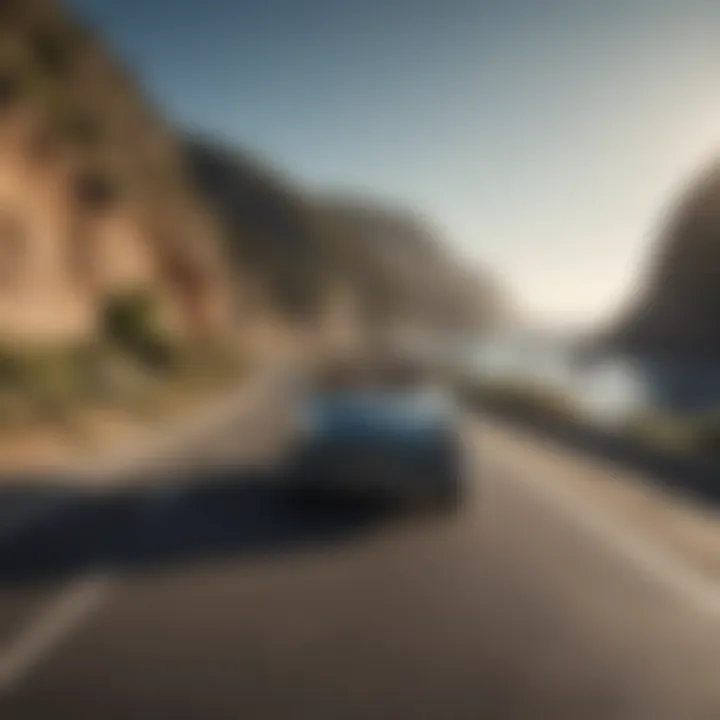 Vintage convertible car driving along a scenic coastal road